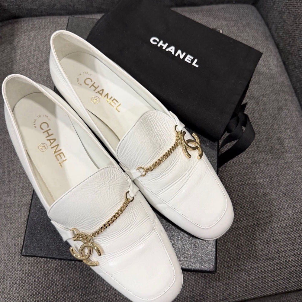 CHANEL White Flats with Gold Chain Accent